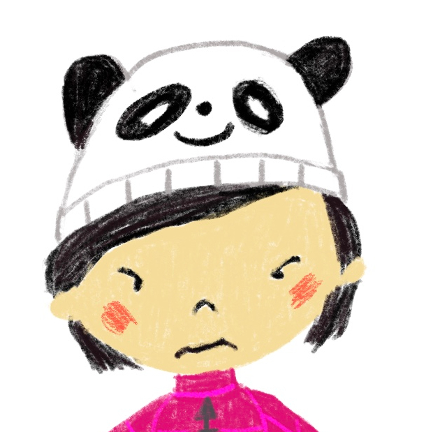 Grumpy little girl wearing smiling panda hat